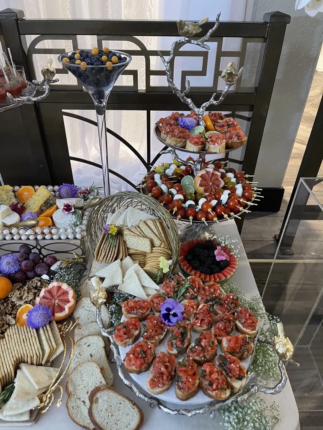 Tiered L’Amore event display with appetizers and grazing details