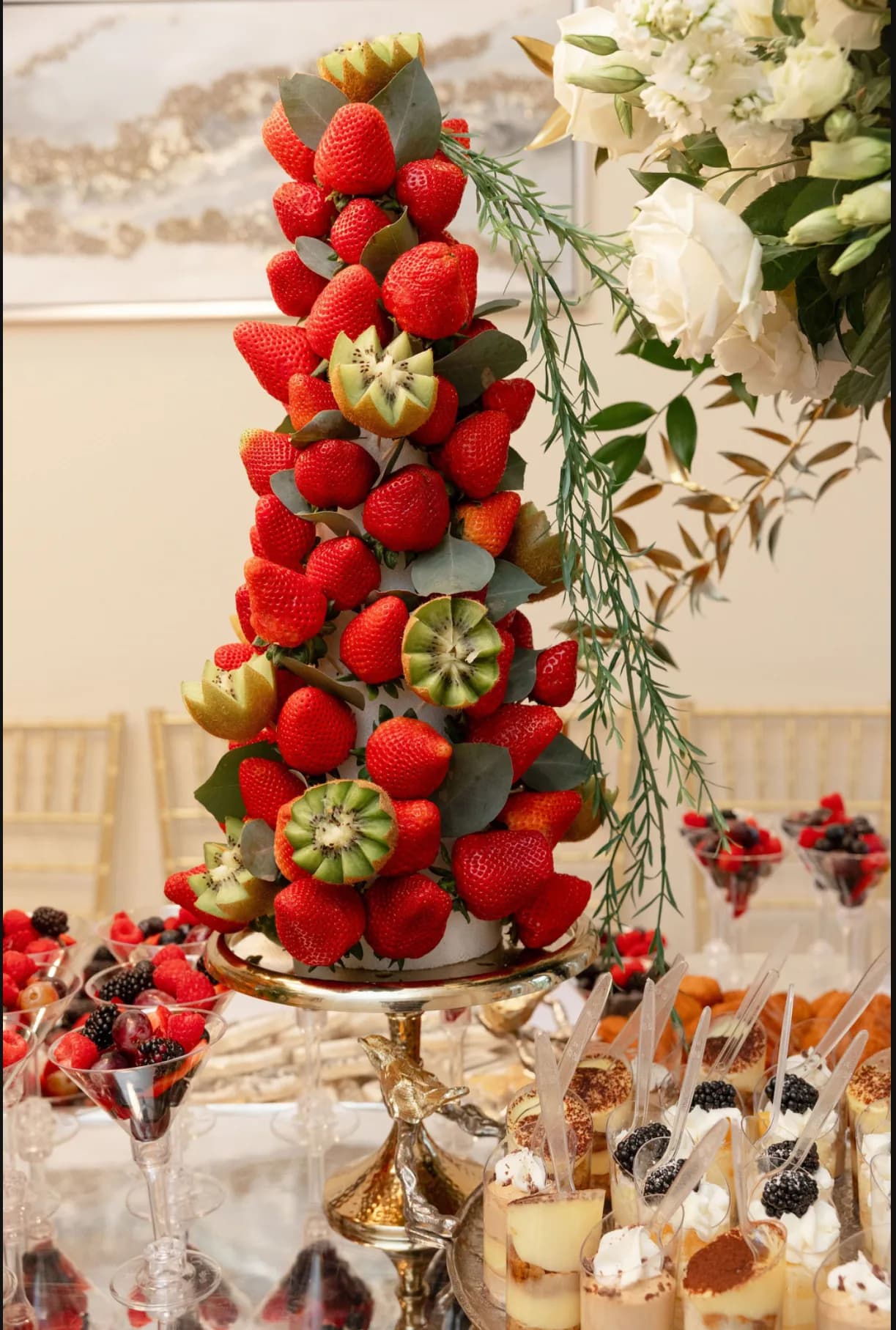 Fruit tower and sweets table styled for a L’Amore celebration