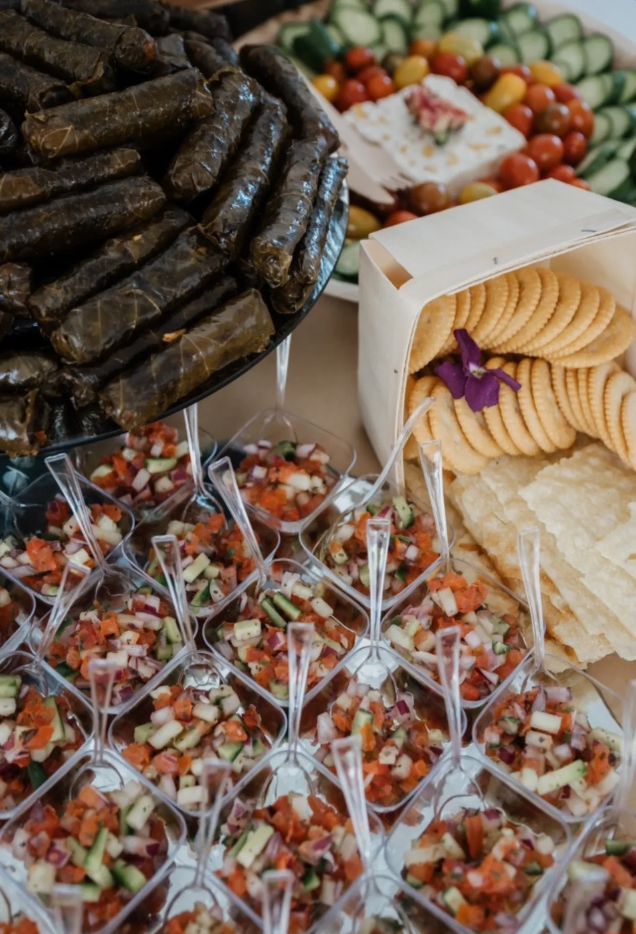 L’Amore catering table with savory appetizer cups and pinwheel bites
